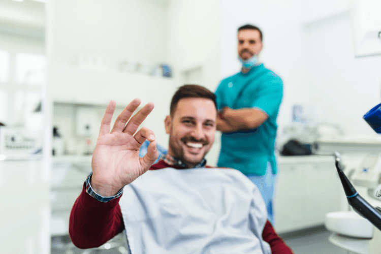 A happy patient, pleased with the results of his dental implant treatment.
